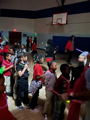 students in line for glow sticks